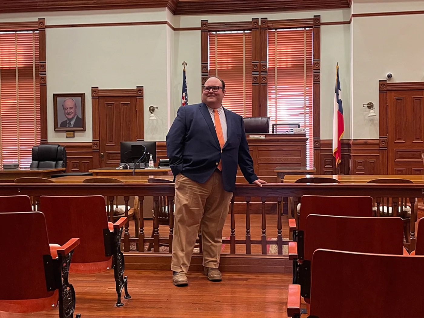 Attorney Brian M. Cromeens standing in a wood-panelled courtroom